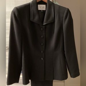 Vintage petite black pantsuit with satin trimmed lapels and buttons. Size 2P.